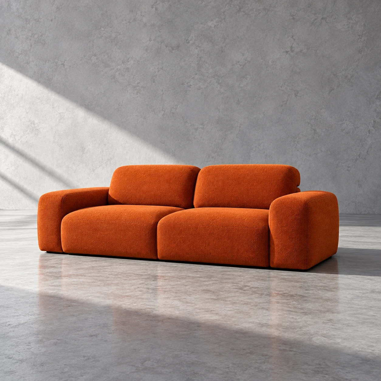 Low sculptural sofa in orange textured upholstery